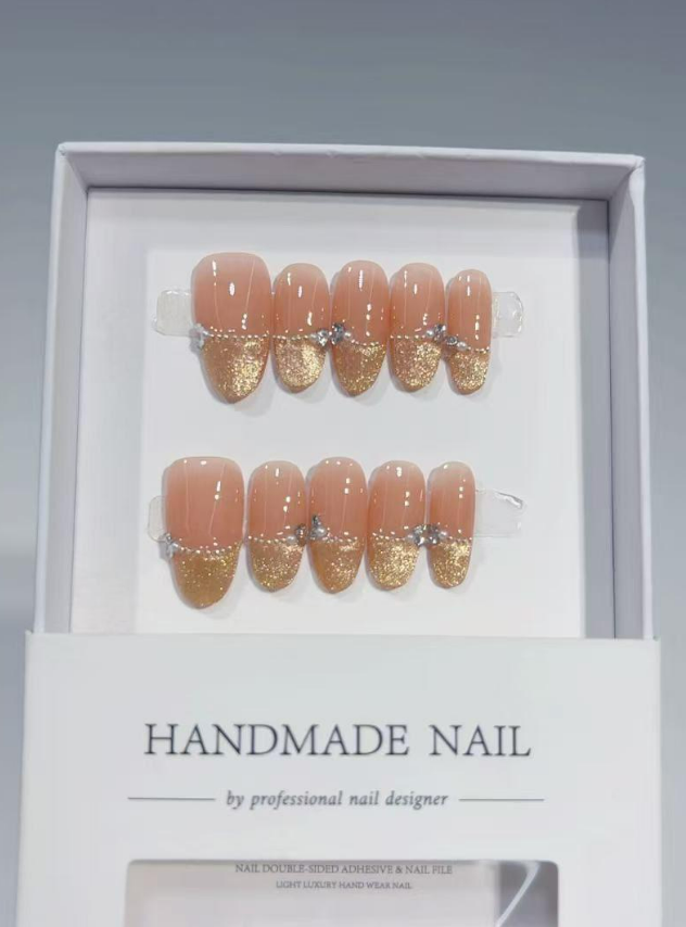 Medium Oval Nude & Shimmering Gold French Tip With Crystals